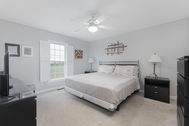 bedroom featuring ceiling fan and light colored carpet