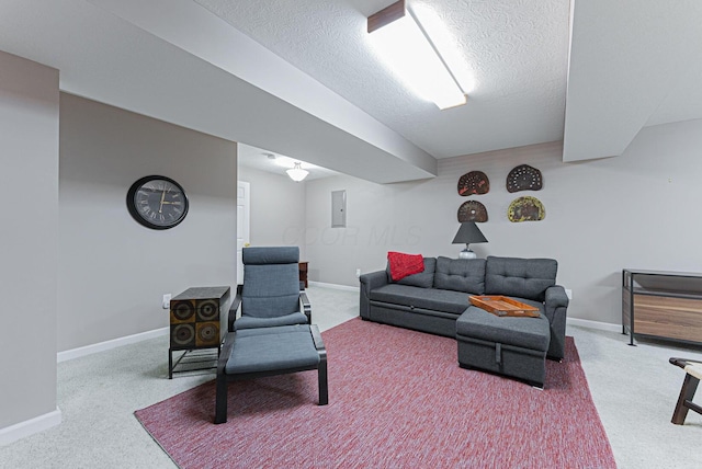 living room featuring electric panel, carpet, and a textured ceiling