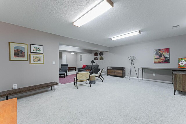 office area featuring carpet and a textured ceiling