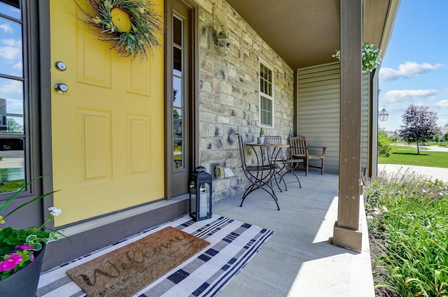 property entrance with covered porch