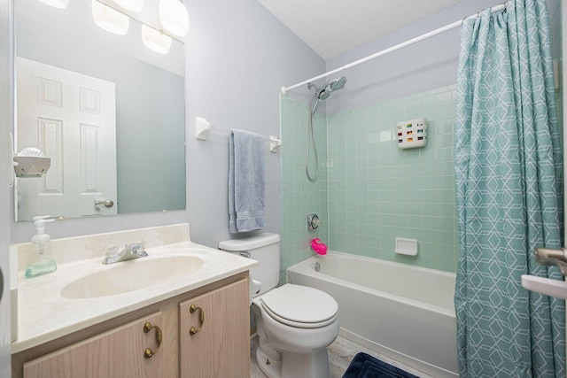 full bathroom with shower / tub combo with curtain, vanity, toilet, and a textured ceiling