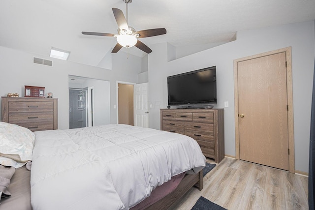 bedroom with lofted ceiling, ceiling fan, and light hardwood / wood-style flooring