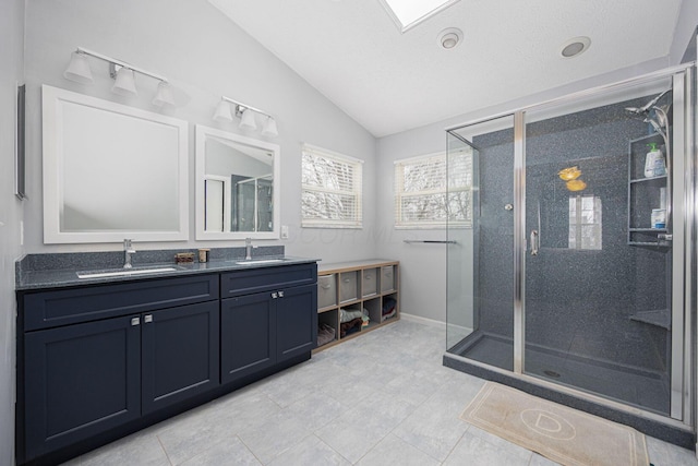 bathroom with vanity, walk in shower, a textured ceiling, and lofted ceiling