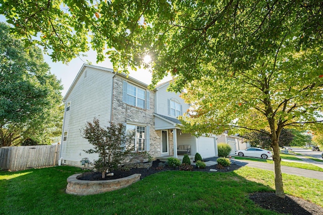 view of front facade with a garage and a front lawn