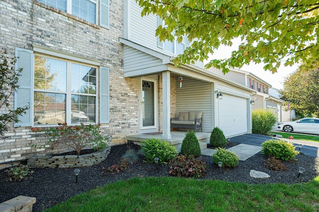 view of front of property with a garage and a porch