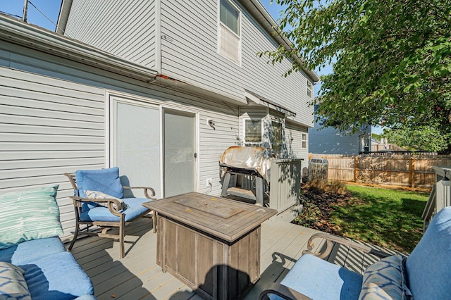 wooden terrace with area for grilling