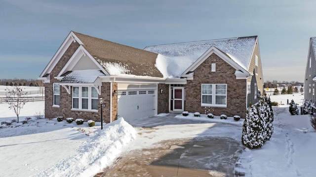 view of front of home featuring an attached garage and brick siding