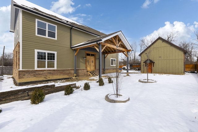 view of snow covered house