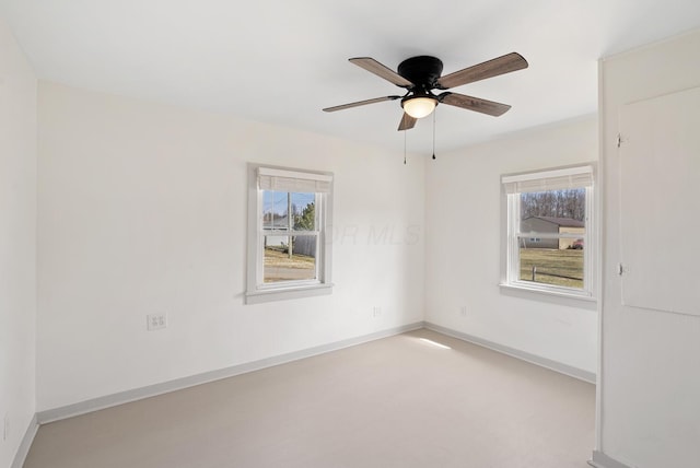 2029 Fairfax Ave, Columbus, OH 43207 - spare room featuring baseboards, a healthy amount of sunlight, and a ceiling fan
