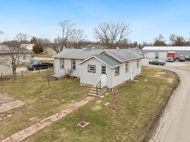 2029 Fairfax Ave, Columbus, OH 43207 - bungalow-style house featuring a front yard, an outbuilding, and a shingled roof