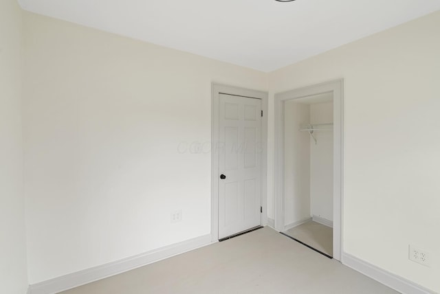 2029 Fairfax Ave, Columbus, OH 43207 - unfurnished bedroom with a closet, concrete flooring, and baseboards