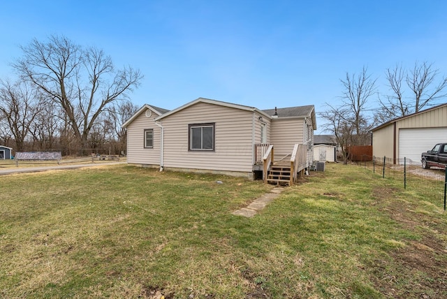 2029 Fairfax Ave, Columbus, OH 43207 - rear view of house featuring an outdoor structure, a yard, and fence