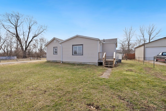 2029 Fairfax Ave, Columbus, OH 43207 - rear view of property with a lawn, a garage, and fence