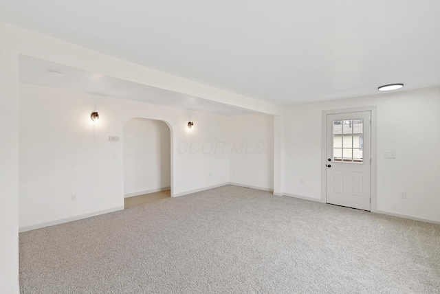 2029 Fairfax Ave, Columbus, OH 43207 - empty room with arched walkways, light colored carpet, and baseboards