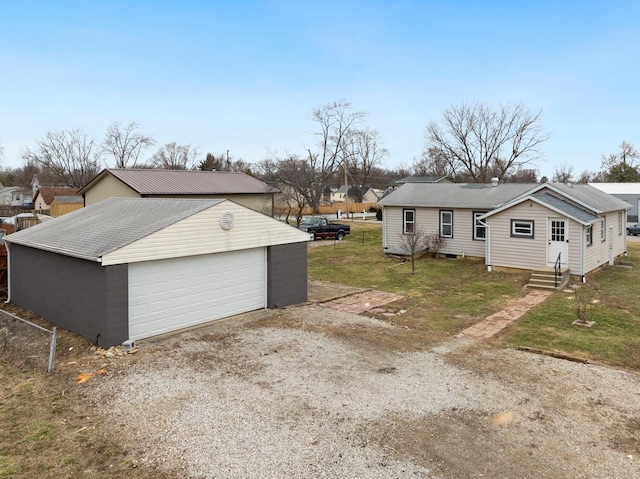 2029 Fairfax Ave, Columbus, OH 43207 - view of home's exterior with entry steps, an outbuilding, a lawn, and a garage