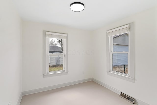 2029 Fairfax Ave, Columbus, OH 43207 - empty room with baseboards, visible vents, and concrete floors