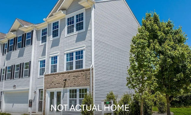 view of side of home with an attached garage