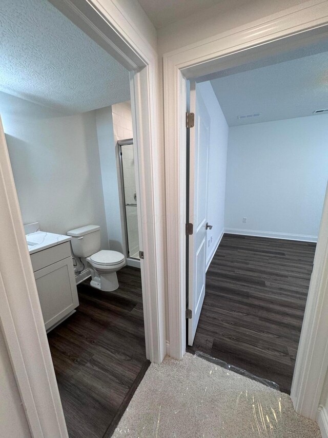 5450 Maple Dr, Lewis Center, OH 43035 - bathroom featuring a shower stall, baseboards, toilet, wood finished floors, and vanity