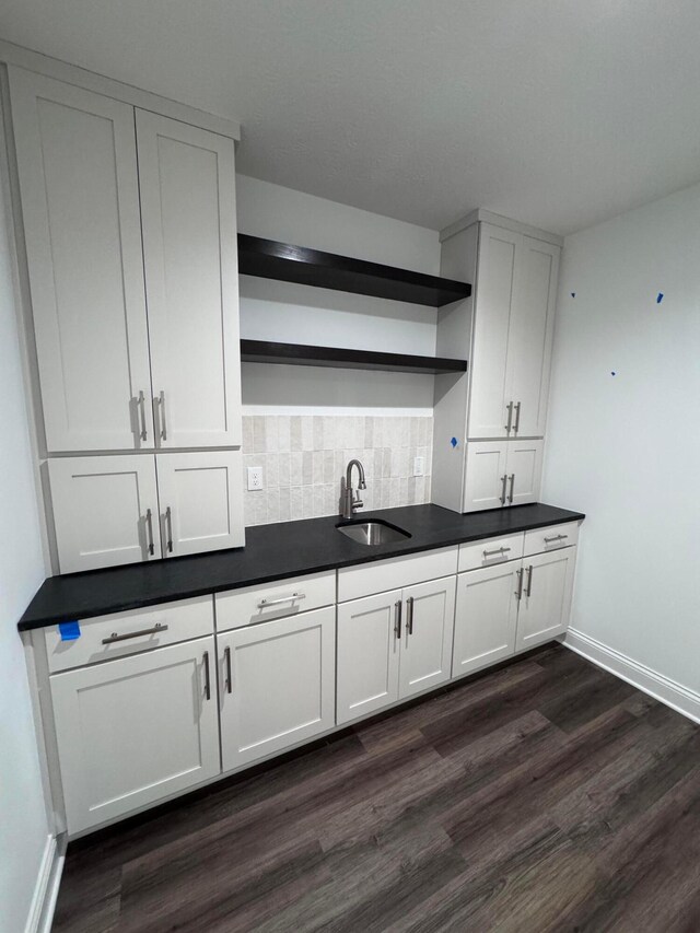 5450 Maple Dr, Lewis Center, OH 43035 - kitchen with open shelves, backsplash, dark wood-style flooring, a sink, and baseboards