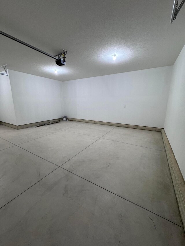 5450 Maple Dr, Lewis Center, OH 43035 - garage with a garage door opener and baseboards