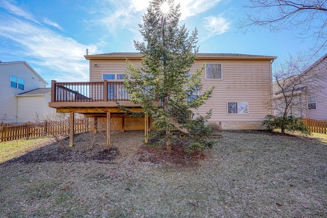 back of house with a wooden deck