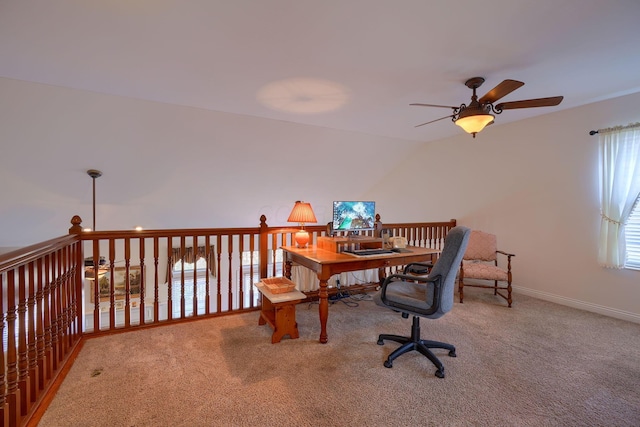 carpeted office featuring ceiling fan