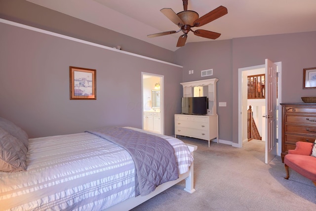 carpeted bedroom featuring ensuite bath, lofted ceiling, and ceiling fan