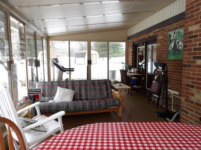 sunroom with lofted ceiling