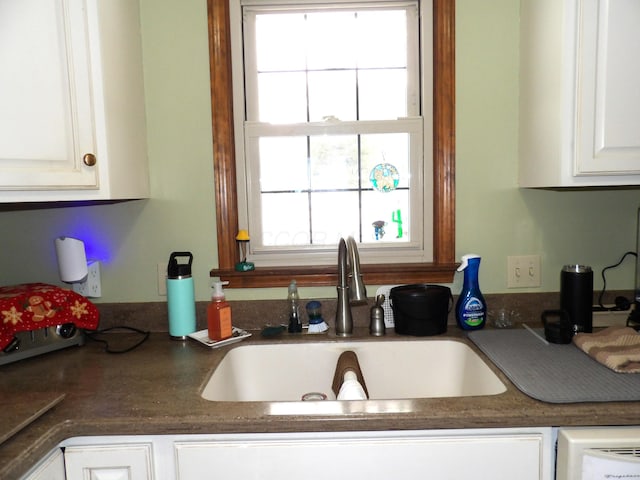 kitchen with white cabinets and sink