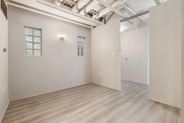 below grade area featuring wood finished floors