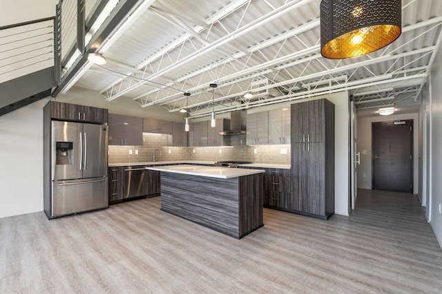 kitchen with light countertops, appliances with stainless steel finishes, and modern cabinets