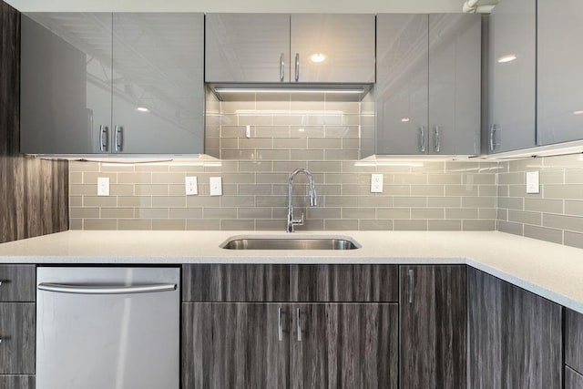 kitchen with dark brown cabinetry, a sink, dishwasher, decorative backsplash, and modern cabinets