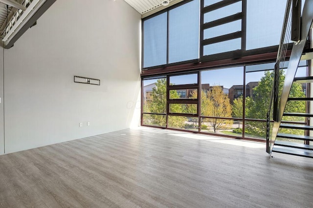 unfurnished living room with wood finished floors
