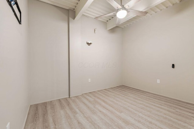 unfurnished room featuring light wood finished floors, ceiling fan, and beamed ceiling
