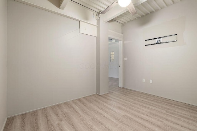 spare room with a ceiling fan and light wood-type flooring
