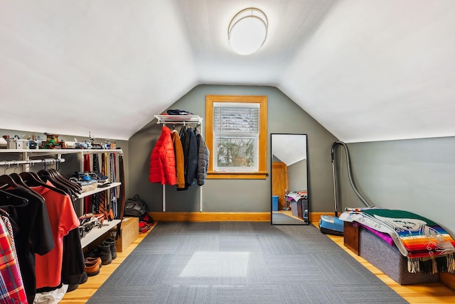 interior space with lofted ceiling and wood finished floors