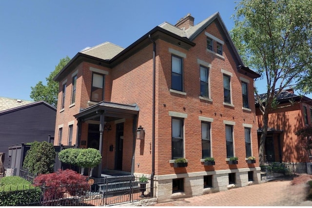 view of building exterior featuring a fenced front yard