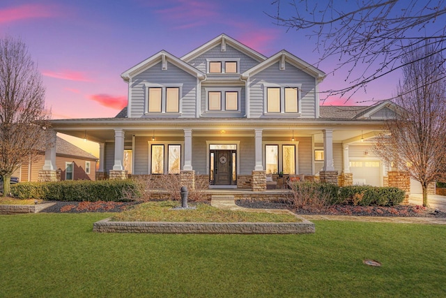 craftsman-style house with a porch and a lawn