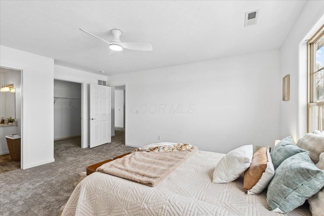 bedroom with a ceiling fan, baseboards, visible vents, and carpet flooring