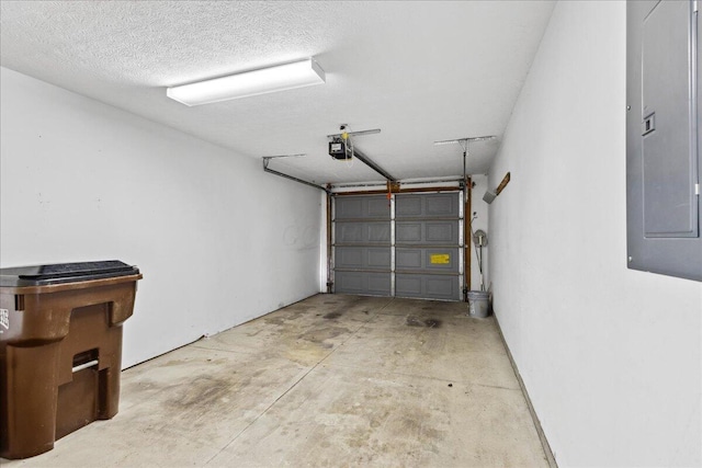 garage featuring a garage door opener and electric panel