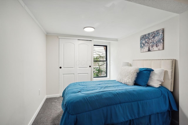 bedroom with carpet floors, ornamental molding, and a closet