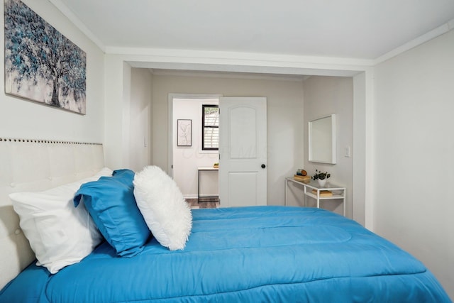 bedroom featuring crown molding