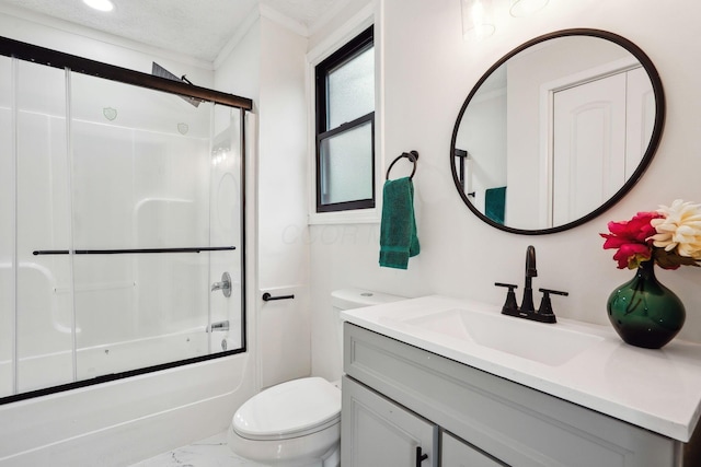 full bathroom featuring toilet, vanity, and combined bath / shower with glass door