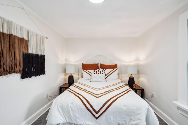 bedroom featuring crown molding and carpet