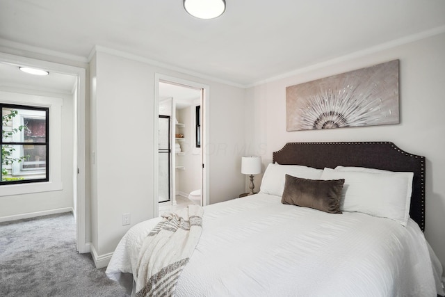 bedroom featuring carpet floors, ornamental molding, and ensuite bathroom