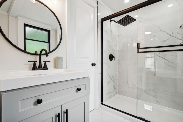 bathroom featuring an enclosed shower and vanity