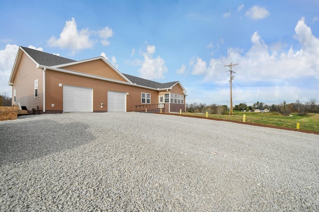 ranch-style home with a garage