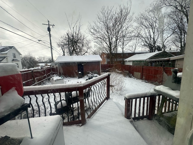 235 Oak St, Marion, OH 43302 - snow covered deck featuring a storage unit