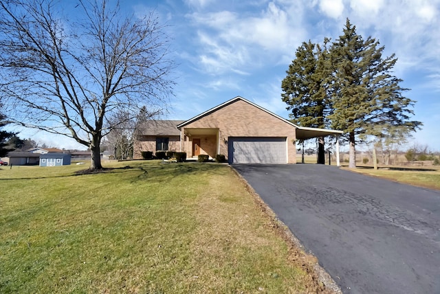 view of front of house with a garage, driveway, an attached carport, and a front yard