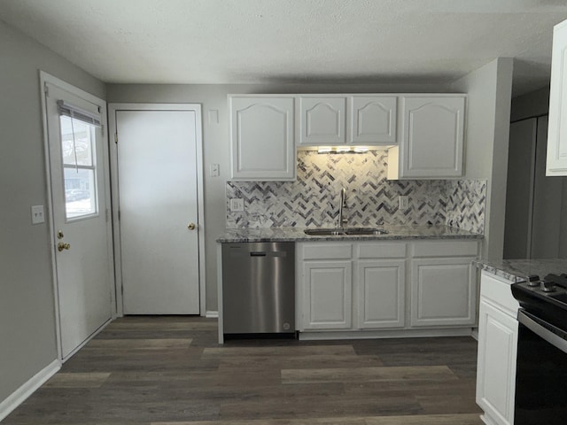 kitchen with light stone counters, white cabinets, a sink, and stainless steel dishwasher